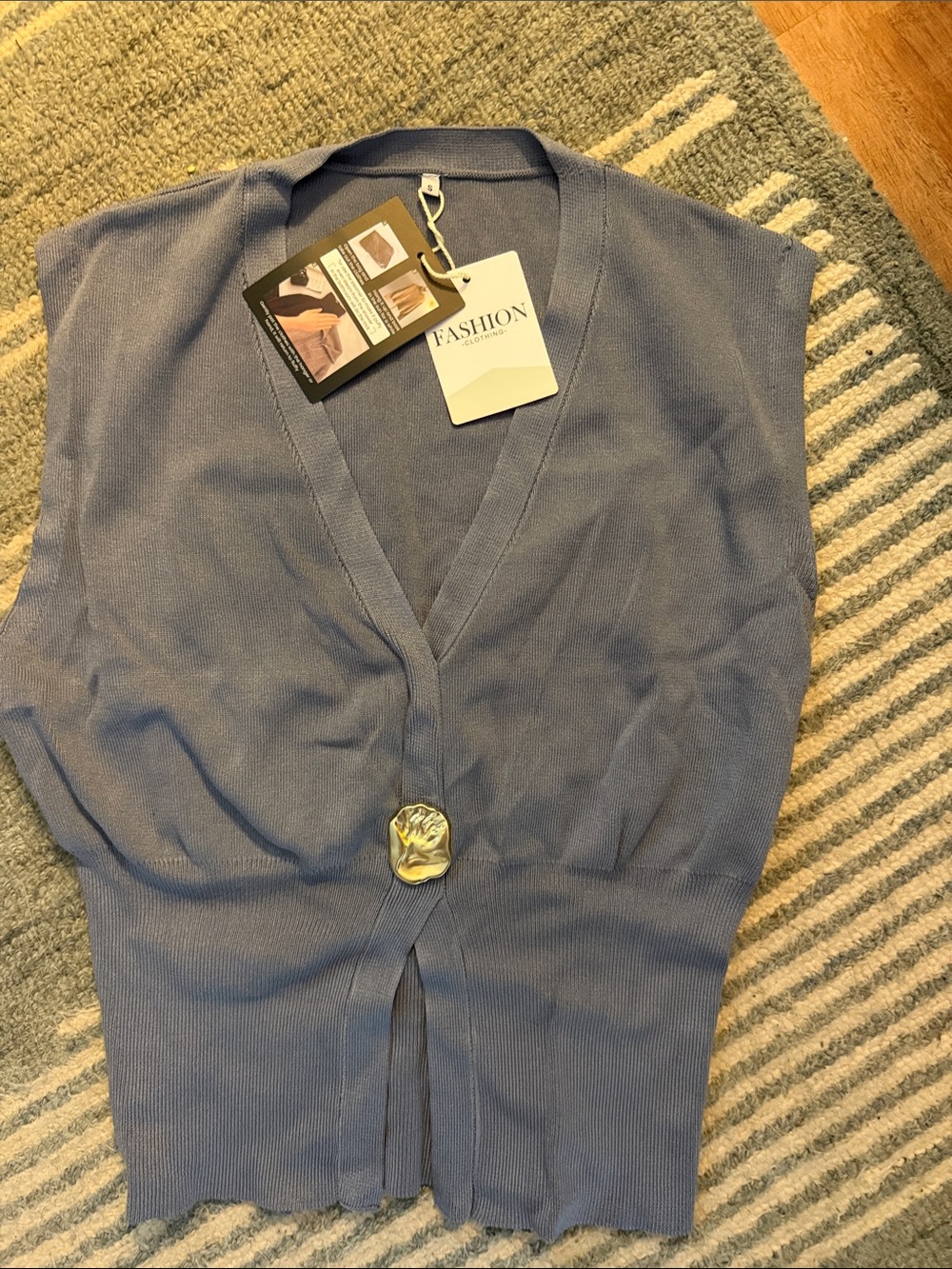 Amazon Blue V-Neck Sleeveless Knit Sweater with Gold Accent